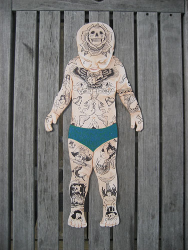 “Tattooed Baby” by Martina Segundo Russo – Mixed media on custom wood cutout